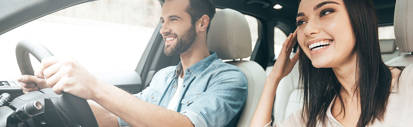 father teaching her daughter how to drive.